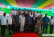 Mr Opoku (middle) with other dignitaries and the graduates at the programme