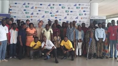 Mr Hammond (squatting middle) with other participants at the training programme