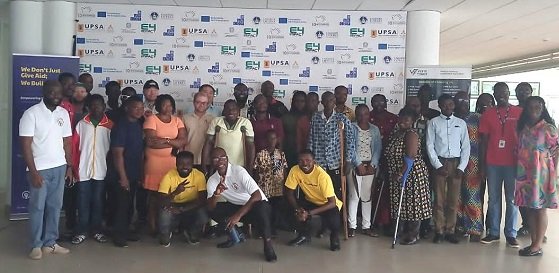 Mr Hammond (squatting middle) with other participants at the training programme