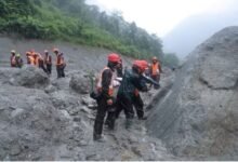 A photo of rescue workers taking part in a rescue operation near the tunnel of the Trishuli 3A Hydropower Project, following deadly flash floods and mudslides, in Rasuwa, Nepal