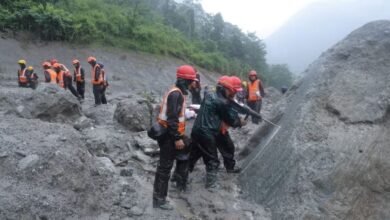 A photo of rescue workers taking part in a rescue operation near the tunnel of the Trishuli 3A Hydropower Project, following deadly flash floods and mudslides, in Rasuwa, Nepal