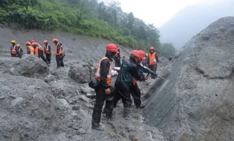 A photo of rescue workers taking part in a rescue operation near the tunnel of the Trishuli 3A Hydropower Project, following deadly flash floods and mudslides, in Rasuwa, Nepal