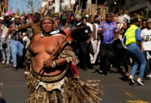 A protester dressed traditional attire marches against illegal immigration, in Johannesburg