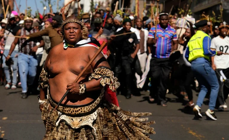 A protester dressed traditional attire marches against illegal immigration, in Johannesburg