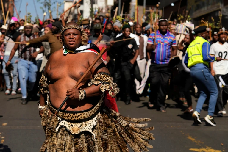 A protester dressed traditional attire marches against illegal immigration, in Johannesburg
