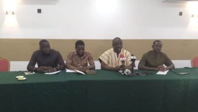 Dr Frimpong (second from right) speaking at the programme. With him are other AFAG members