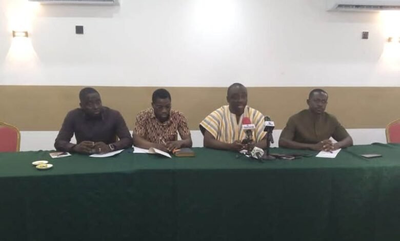 Dr Frimpong (second from right) speaking at the programme. With him are other AFAG members