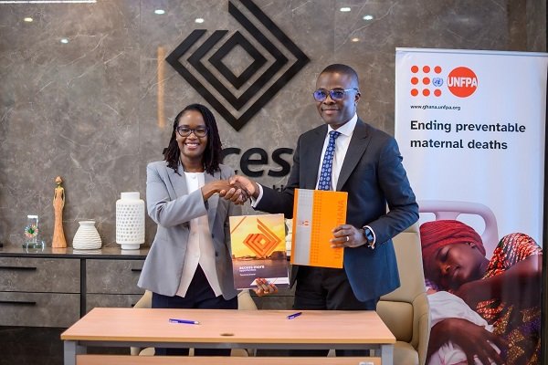 Officials from Access Bank & UNFPA displaying the signed MOU