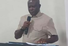 • Mr Mensah (inset) addressing the gathering