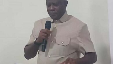 • Mr Mensah (inset) addressing the gathering