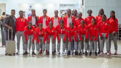 Coach Sampson (left) with the players before departure