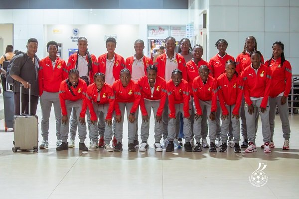 Coach Sampson (left) with the players before departure
