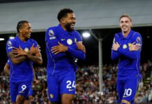 Cole Palmer (left) celebrates scoring the third goal with Joao Pedro and Reece James