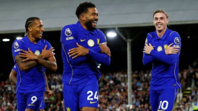 Cole Palmer (left) celebrates scoring the third goal with Joao Pedro and Reece James