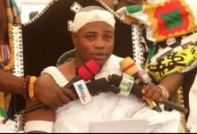 Togbe Nego (inset) addressing Chiefs and Queenmothers at the durbar