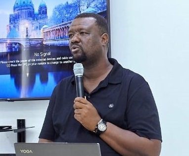 -Mr Neequay Kotey (inset) addressing participants at the workshop
