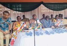 , Nana Kwabena Amponsah IV (middle) addressing the community at the event