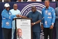 Dr. Debrah (second from right) receiving a citation from Lordship Baffour-Bonnie Photo Geoffrey Buta