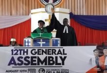 Rt. Rev. Lt. Col. Agbeko (left) introducing Rev. Prof. Amevenku, new Moderator, to the church in Ho