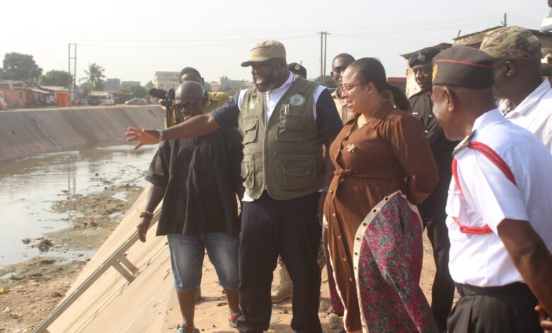 • Mr Kpakpo Allotey, (hand raised) Chief Executive of AMA, brief ing Ms. Linda Ocloo (second from right) on the impact of the June 29 floods at Alajo during an inspection tour. Photo: Ebo Gorman