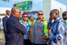 President (left) being briefed during his working visit to the Saglemi Housing project