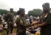 Lt. Gen. W. Agyapong presenting the items to one of the victims