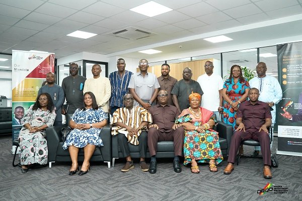 Mr Madjie ( seated third from right) with some Management of the Authority and the Committee members