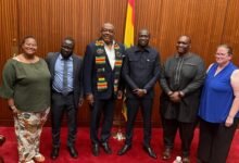 Mr Smith (third from left) with Mr Cook (second from right) and other members to attend the summit