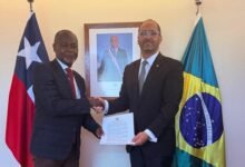 Amb. Namoale (left) exchanging document with Amb. Kort during the visit