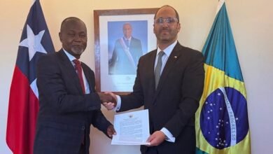 Amb. Namoale (left) exchanging document with Amb. Kort during the visit
