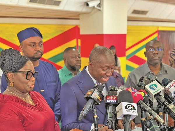 Mr Afenyo-Markin (middle) speaking at the briefing..