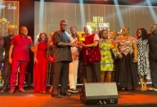 Staff of Publicis West Africa, receiving the award from Mr Ackah (left)
