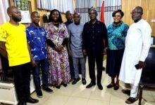 Mr Mburidiba with management of MTN Ghana during the visit