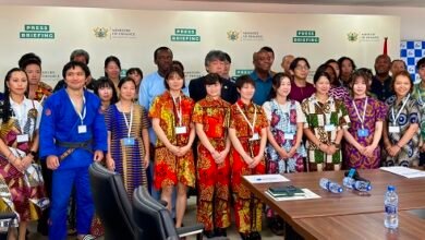 JICA volunteers and officials after the meeting