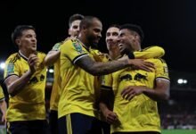 James Justin celebrates their second goal with teammates