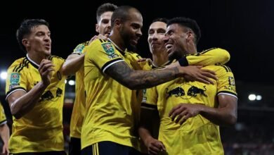 James Justin celebrates their second goal with teammates