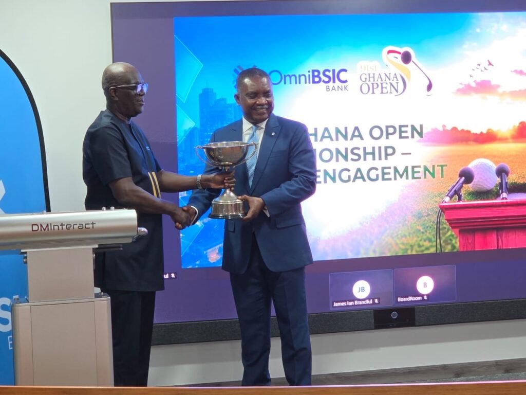 Leonard Kwaku Okyere (L) presenting the tournament men’s trophy to Daniel Asiedu (R) MD of Omnibsic Bank