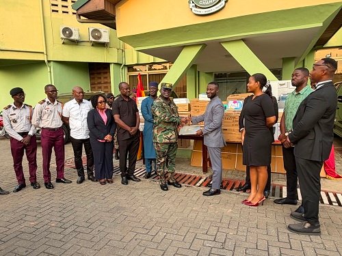 Major General Mantey (seventh from left) receiving the items from Dankwah (fourth from right) at the recemony