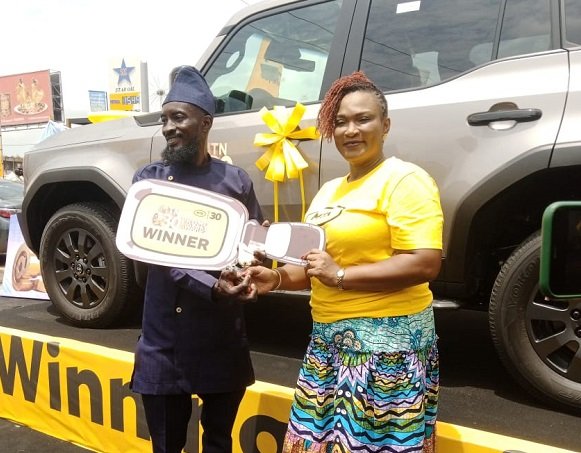 Ms Kotei-Walsh presenting an award to one of the winners