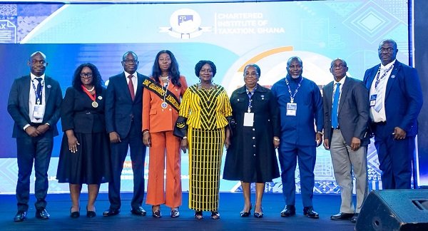Vice President Prof. Opoku-Agyemang (middle) with dignitaries and executives of the Chartered Institute of Taxation, Ghana