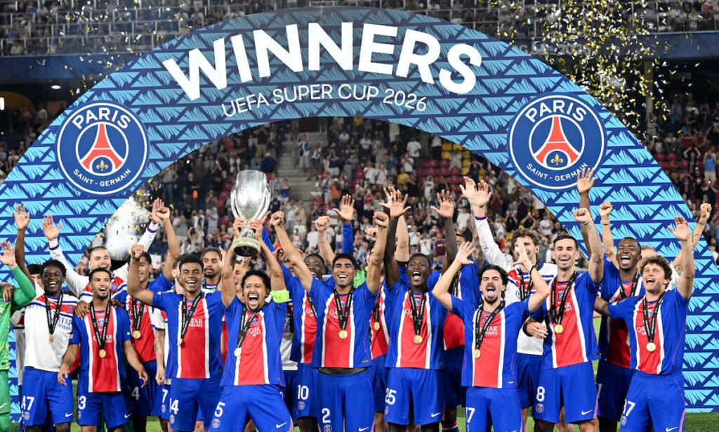 Marquinhos lifts the trophy with teammates after winning the UEFA Super Cup