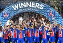 Marquinhos lifts the trophy with teammates after winning the UEFA Super Cup