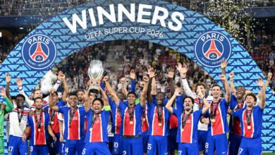 Marquinhos lifts the trophy with teammates after winning the UEFA Super Cup