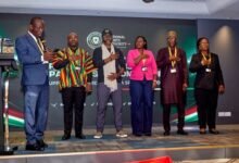 • Dr Awaah (left) swearing-in the committee members