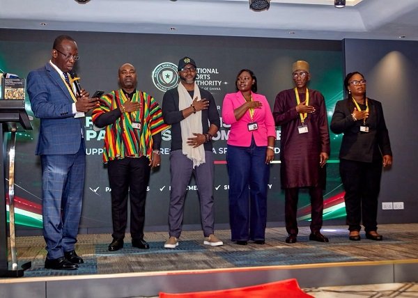 • Dr Awaah (left) swearing-in the committee members