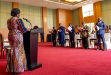Professor Opoku-Agyemang (left) swearing in the new envoys