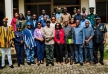 Mr Mburidiba and Dr Graham with other participants after the meeting