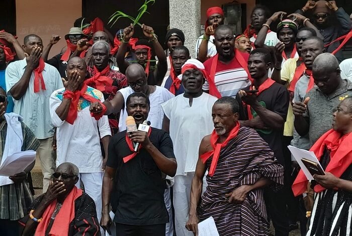 Mr Otu Zor (front row middle) addressing the media