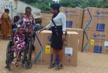 Ms Korankye (right) presenting a deep freezer to a beneficiary