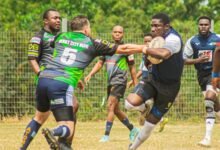 Panthers William Asilevi (with ball) invades a tackle from Abdulrahman Moussa of Dragons